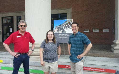 three people standing