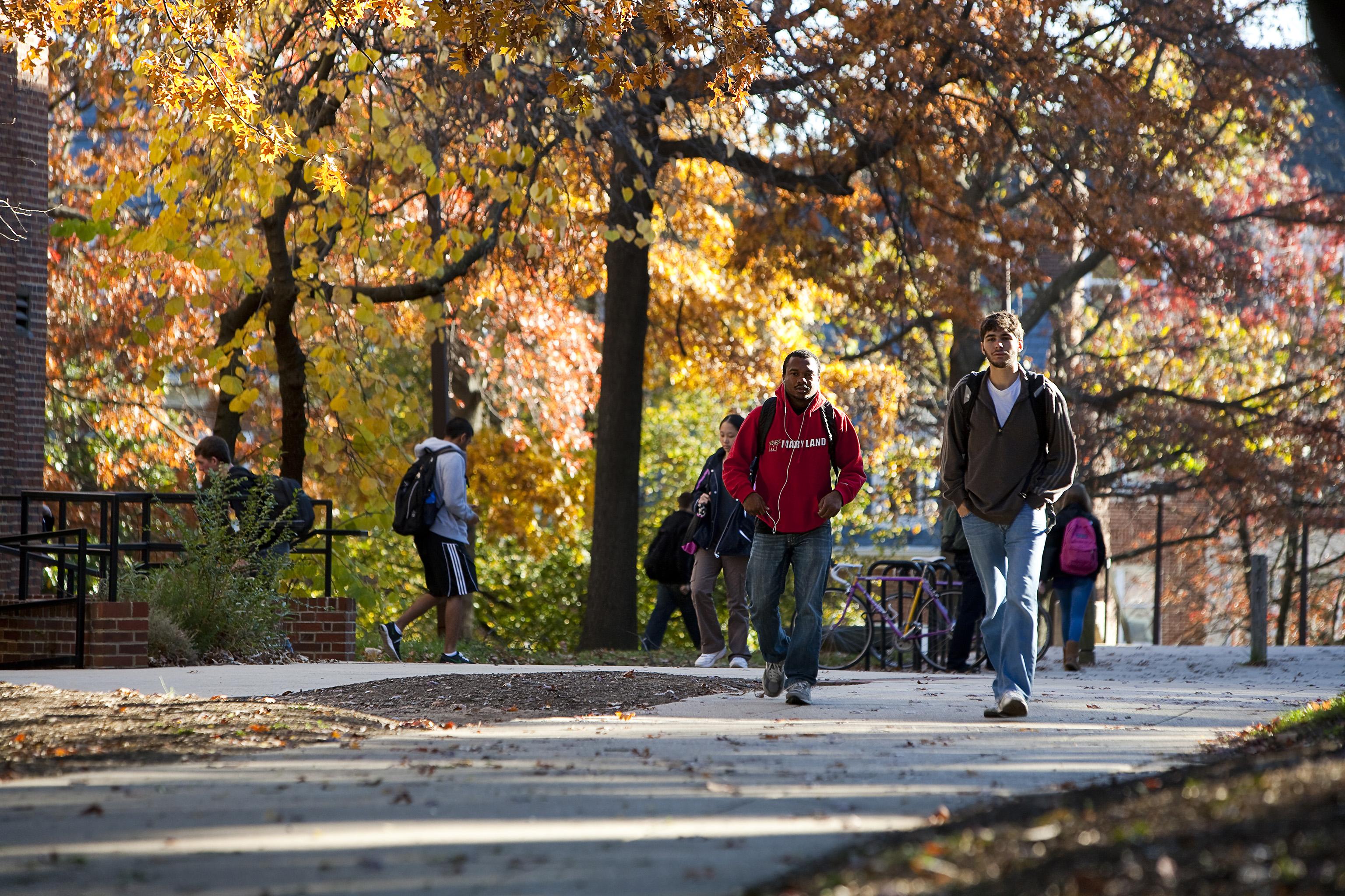 Students Walking Across Campus on a Fall Day