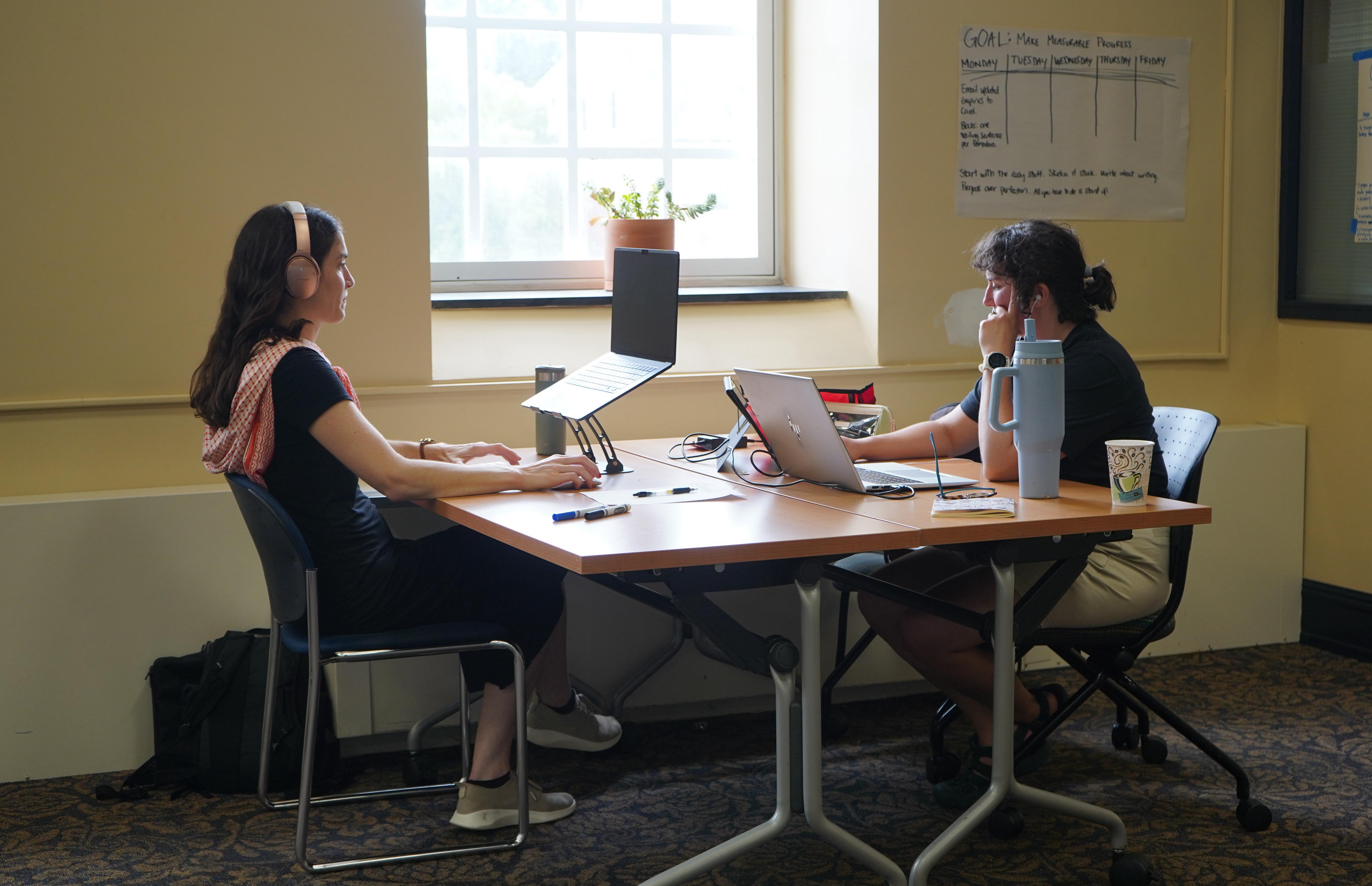 Graduate Students at Writing Retreat, working on laptops
