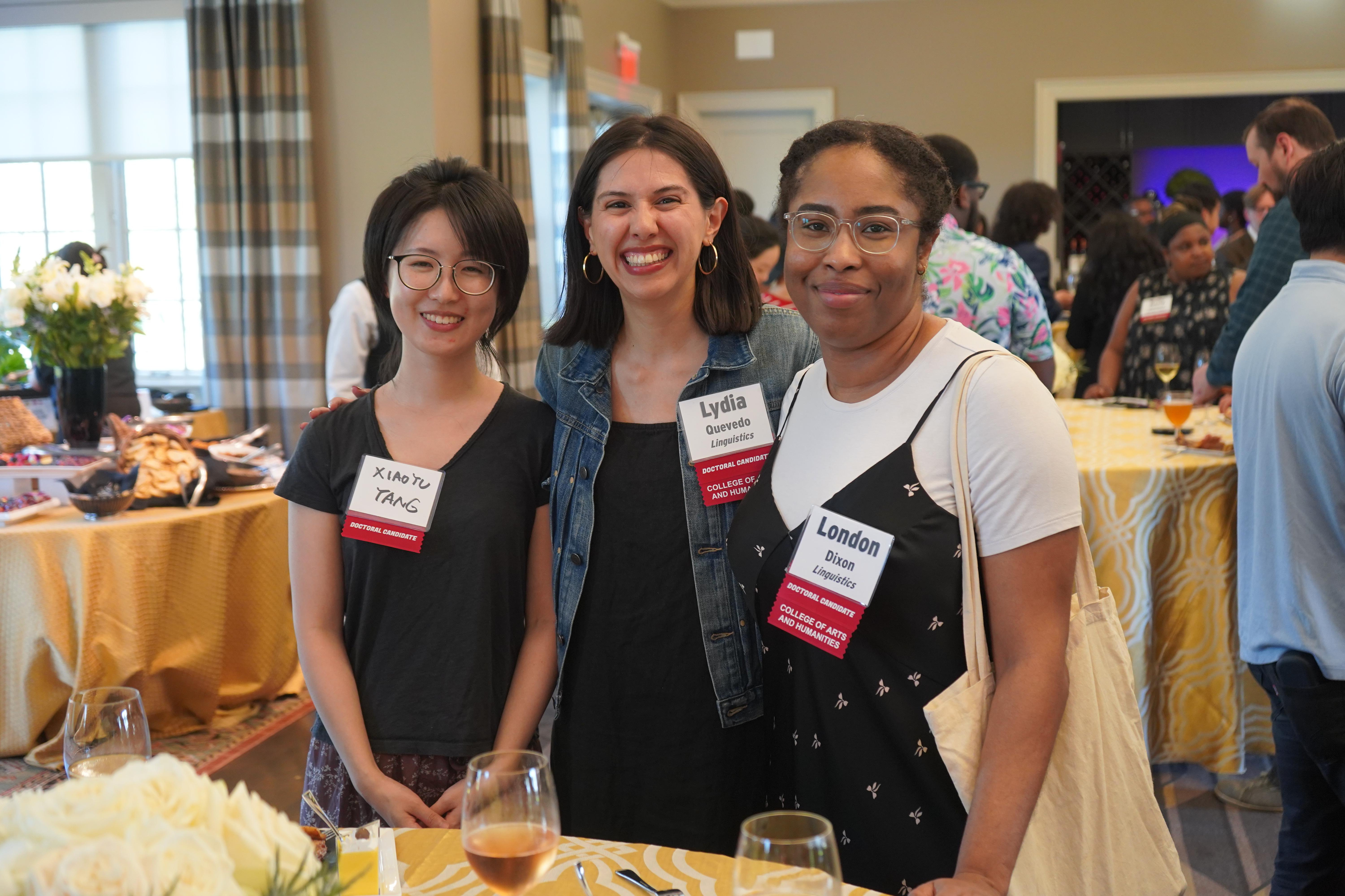 Three Doctoral Candidates at a celebration