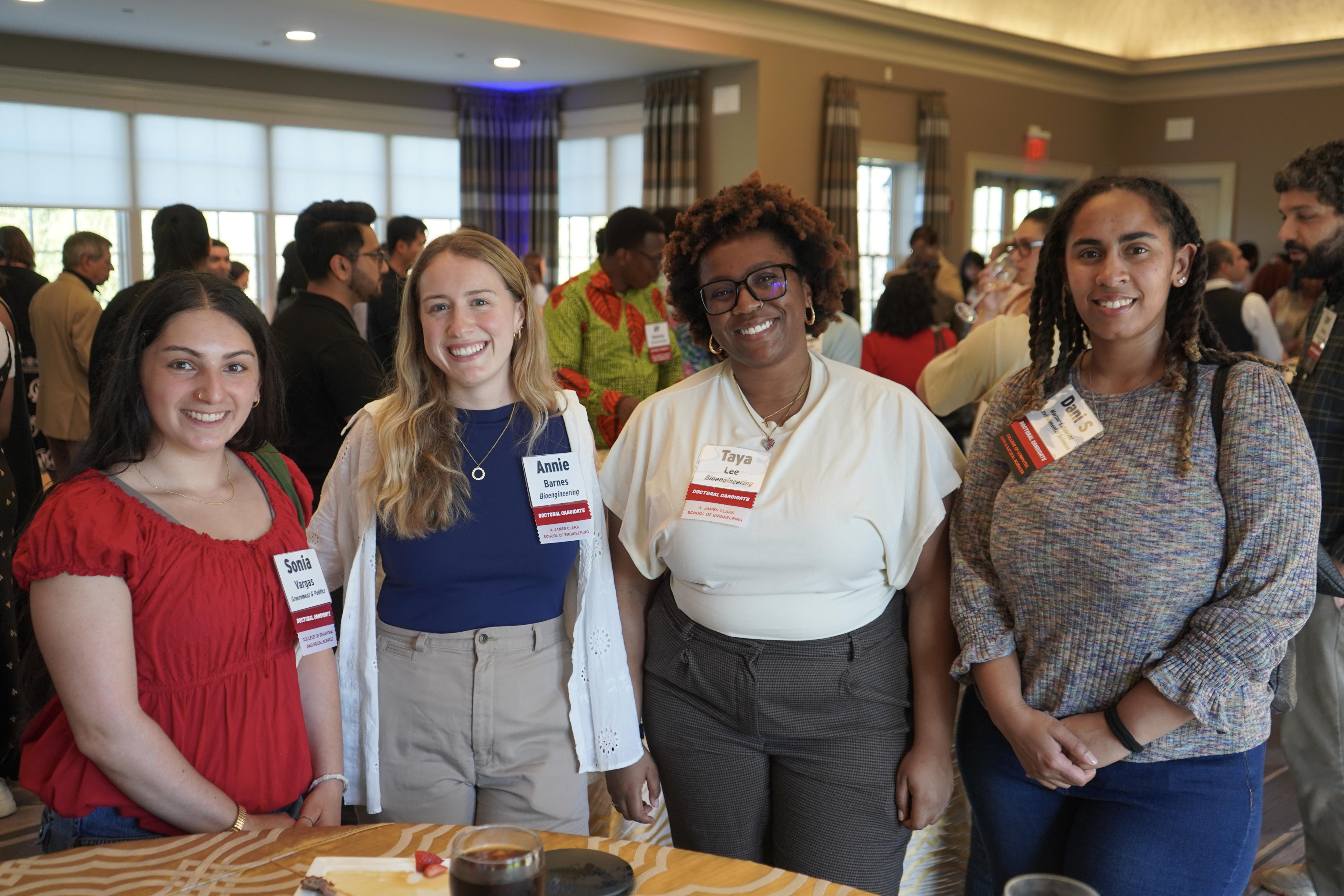 Four Doctoral Candidates at a celebration