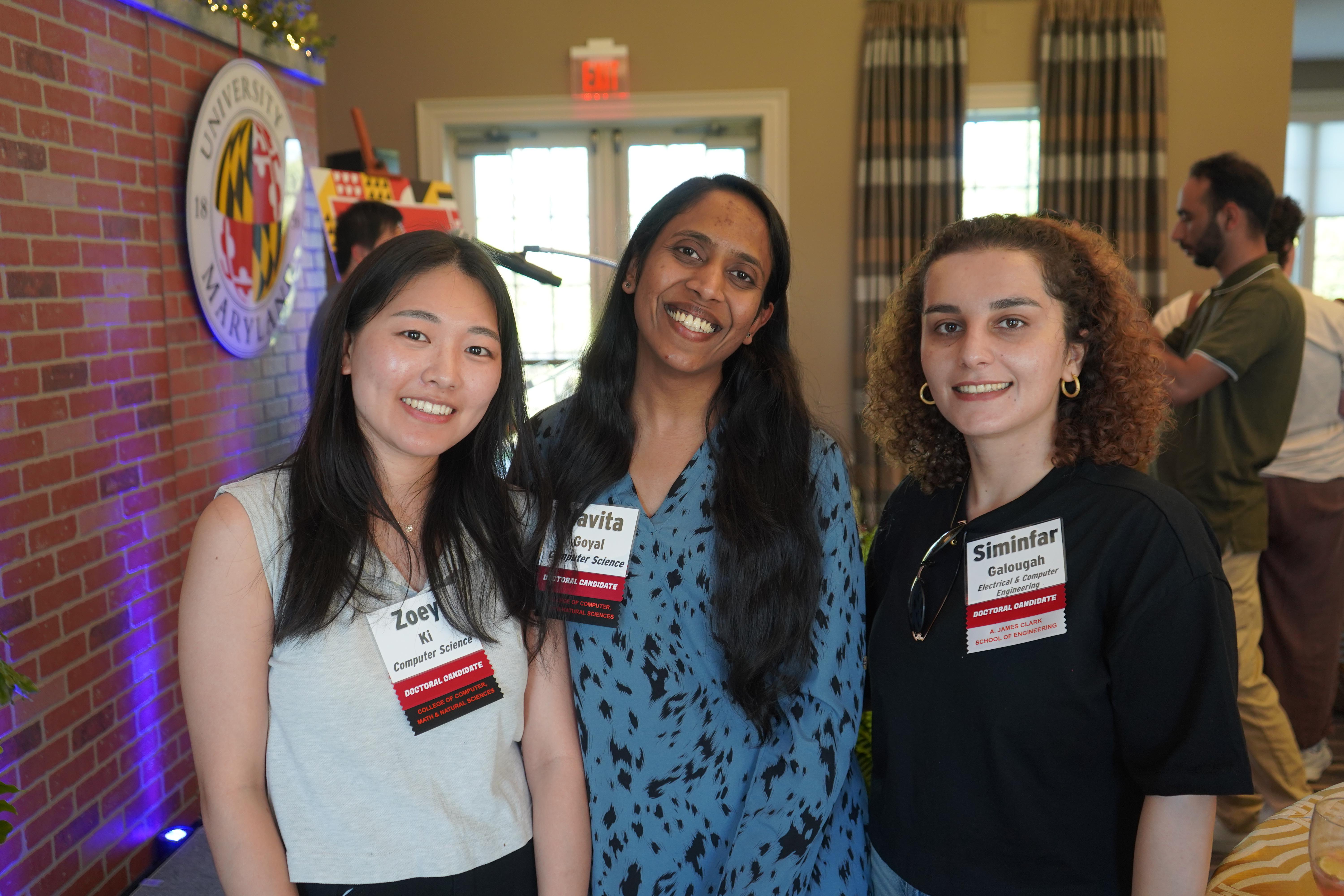 Three Doctoral Candidates at a celebration