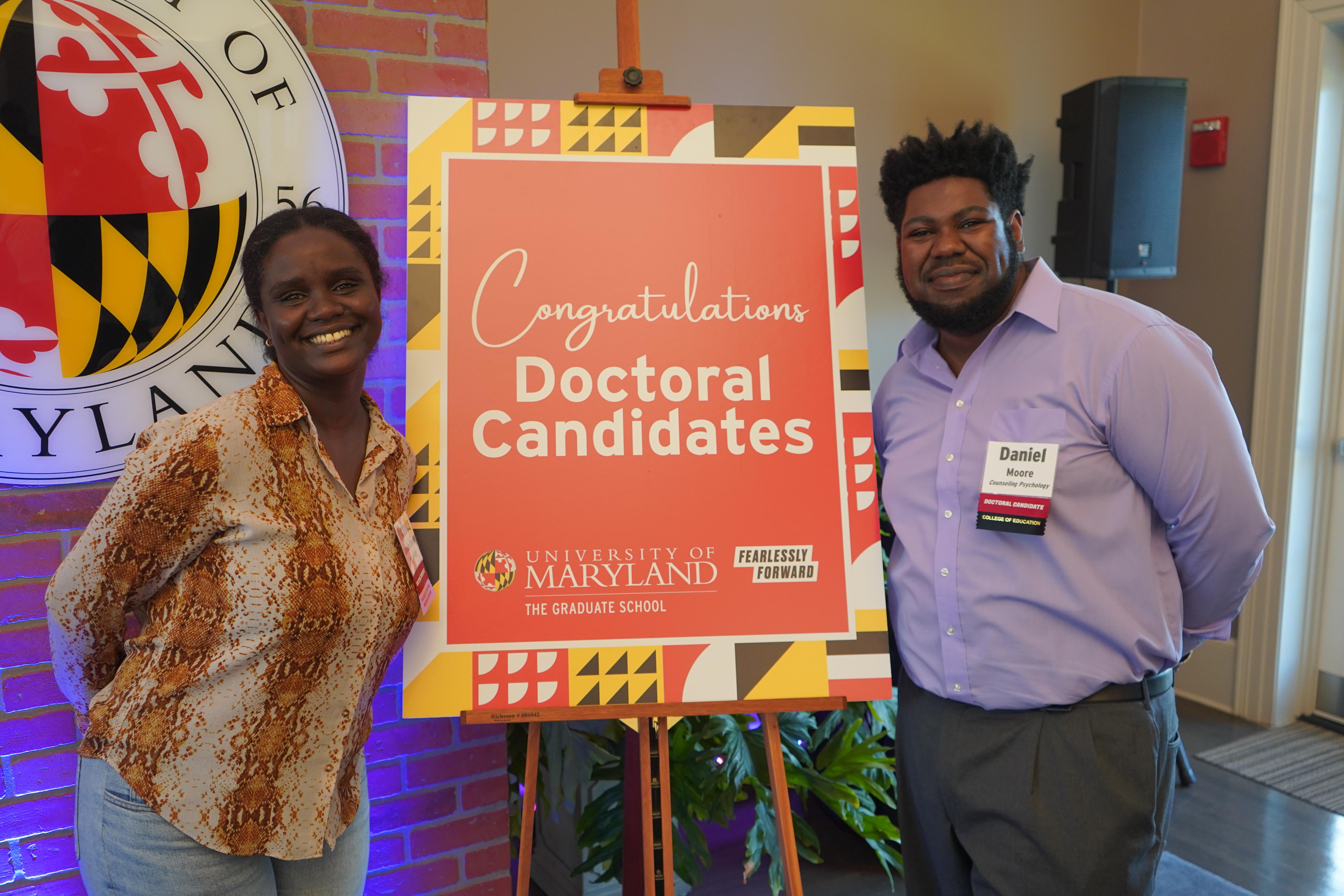 Two Doctoral Candidates at a celebration
