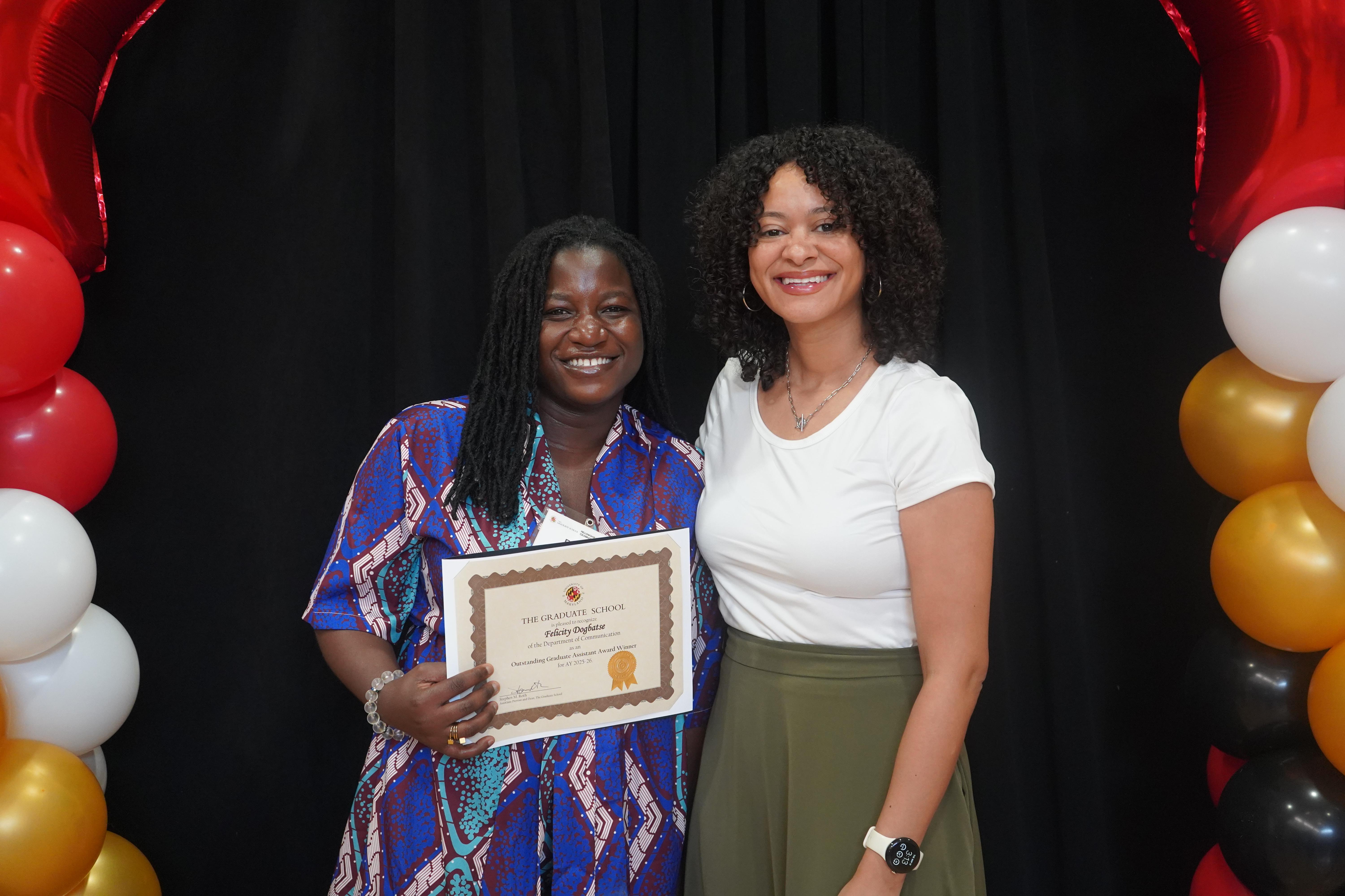 Two graduate students at the annual Fellowship and Award celebration