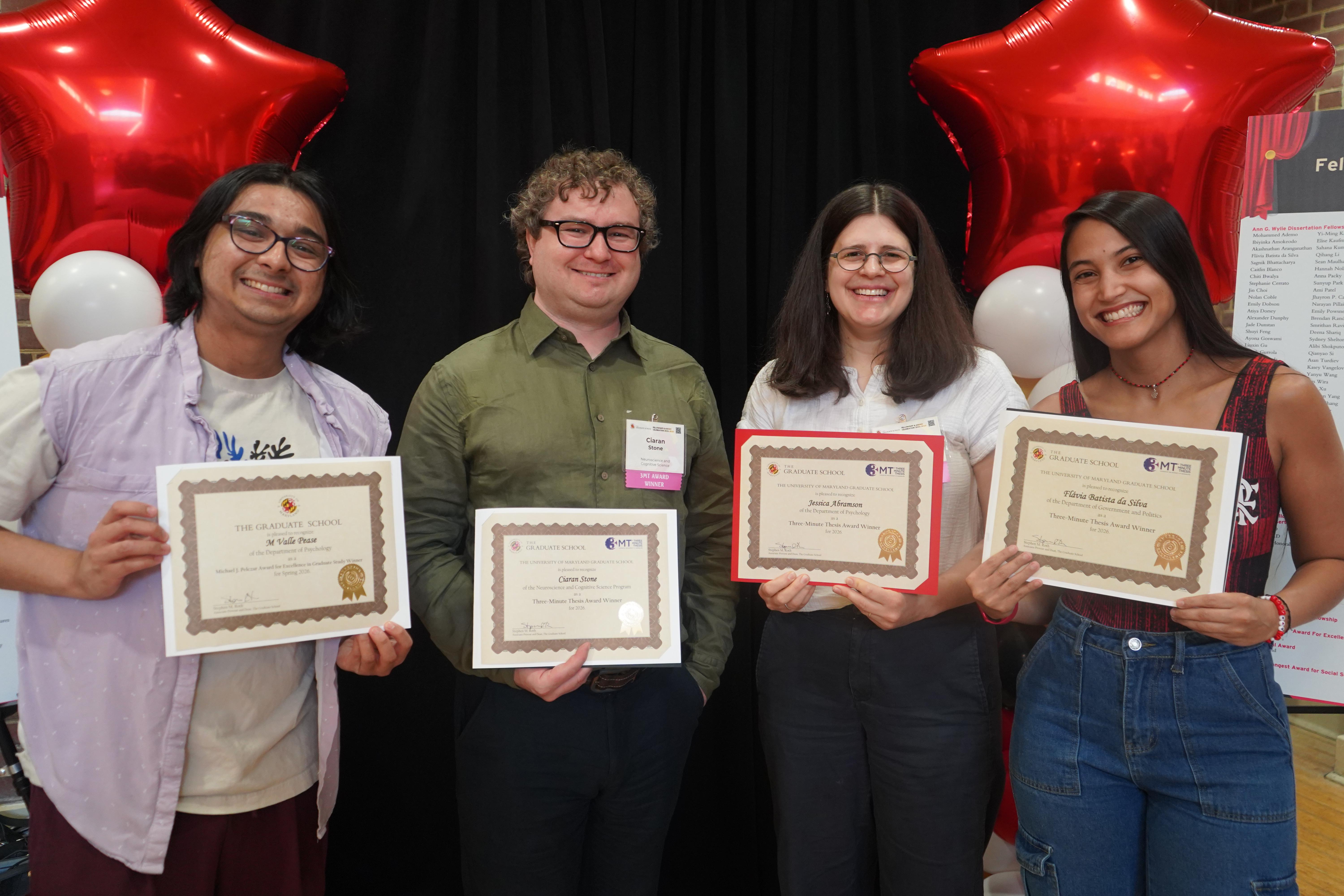 Four graduate students at the annual Fellowship and Award celebration