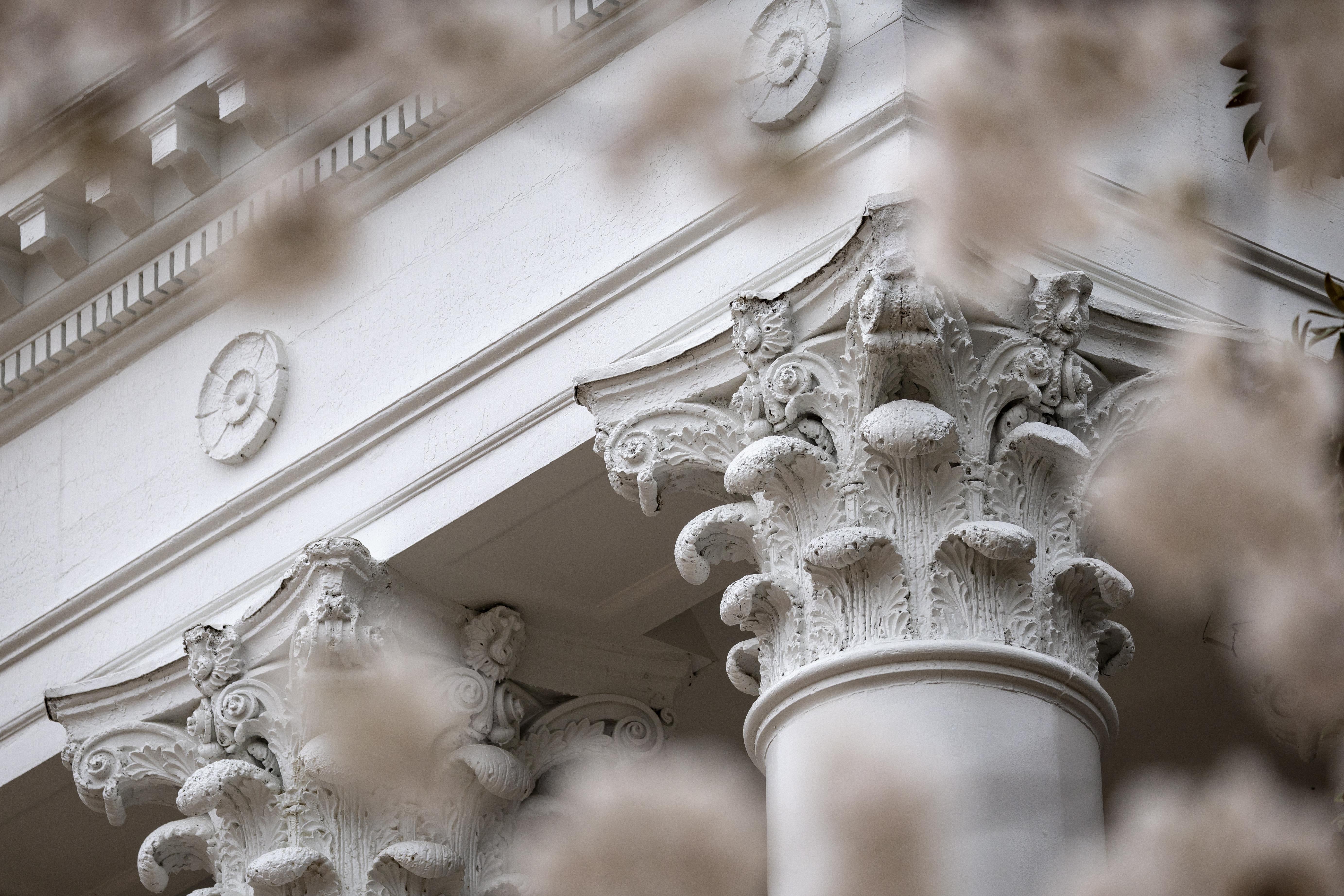 The Armory columns surrounded by cherry blossoms.
