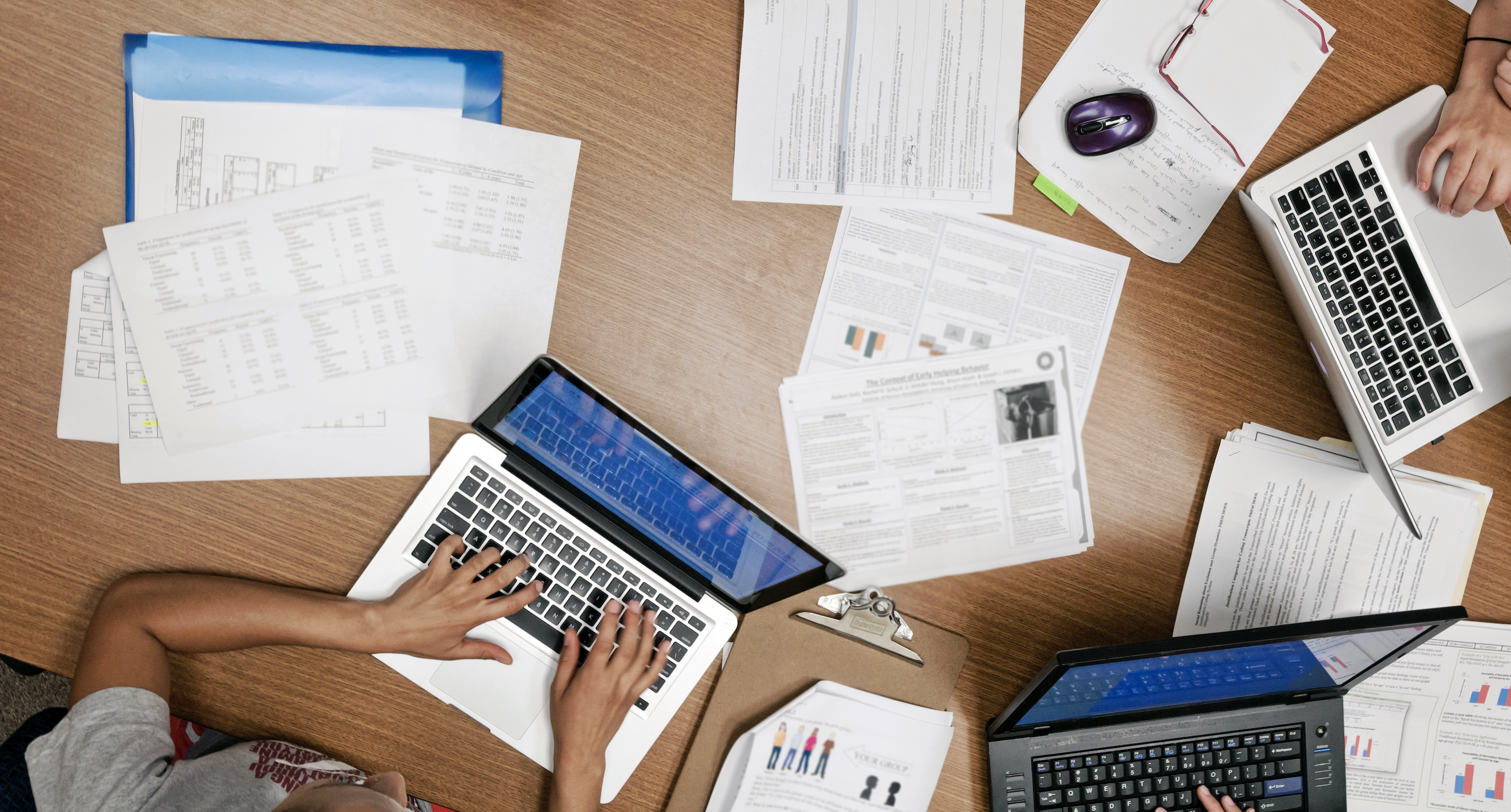 Papers and laptop on desk