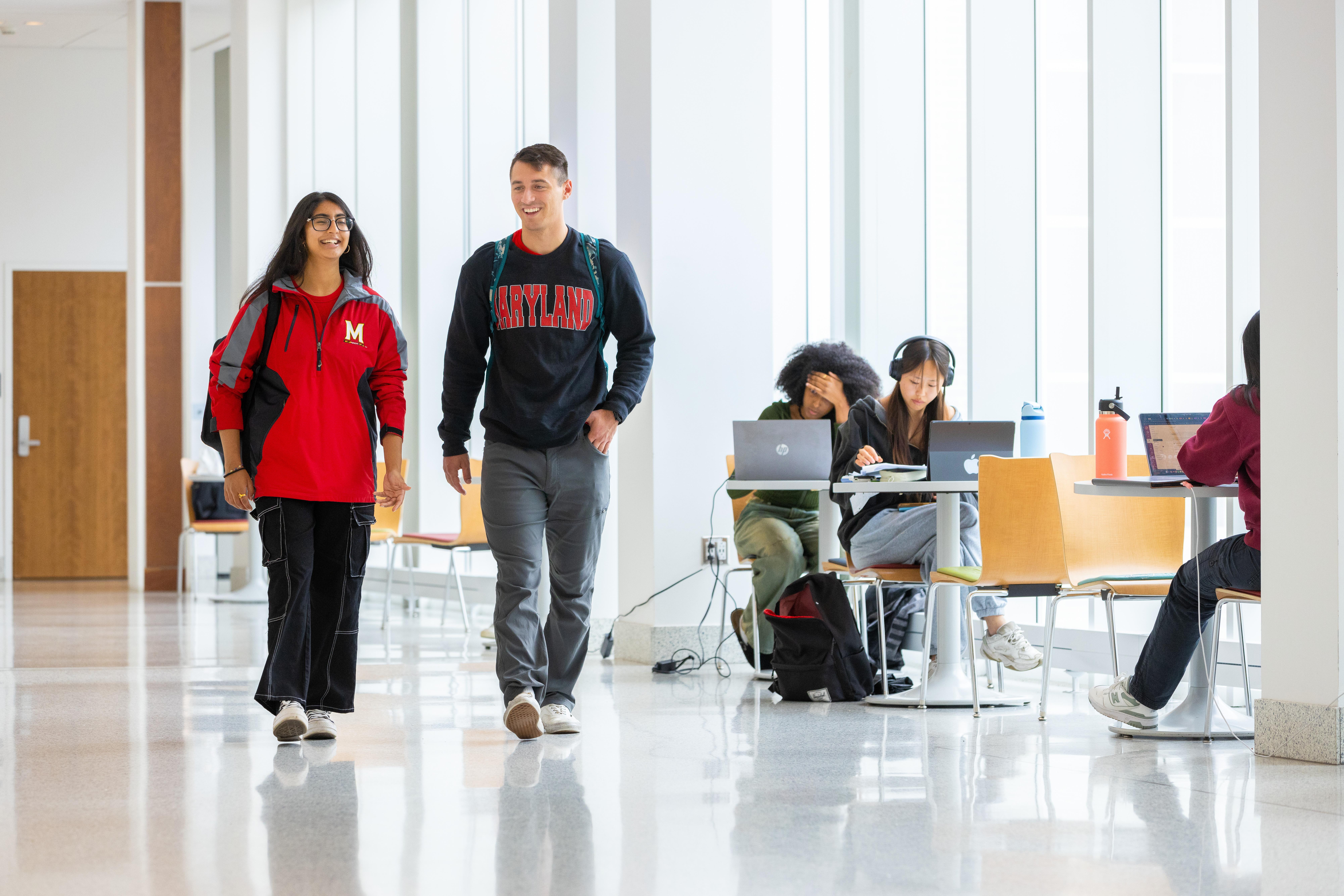 Students walking inside academic building